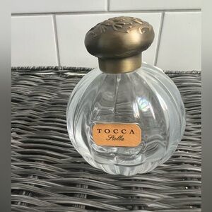 Empty glass bottle Tocca perfume.